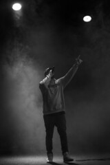 singer and rapper on stage in smoke - obrazy, fototapety, plakaty