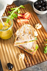 Sandwich with mustard, cheese and sausage