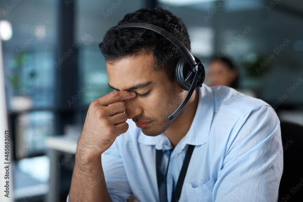 Aufkleber help yourself before you help others. shot of a young man using a headset and looking stressed in a 