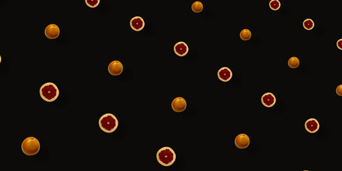 Colorful fruit pattern of fresh grapefruits on black background. Top view. Flat lay. Pop art design