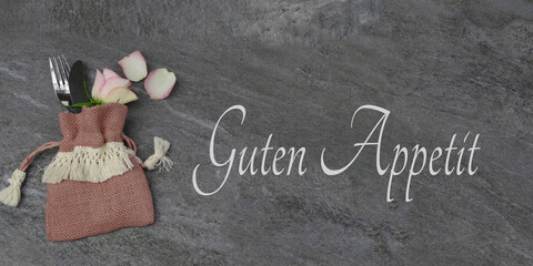 Messer und Gabel mit dem Schriftzug Guten Appetit. - obrazy, fototapety, plakaty
