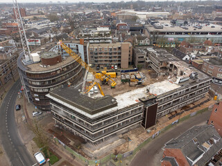Demolition of a police station using building hydraulic shears, aerial