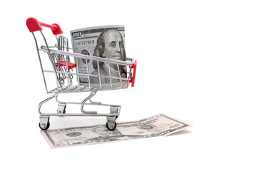 Trolley for transportation of purchases and one hundred dollar bill on a white background. The concept of payment and transportation of goods in the form of a trolley and one hundred dollars