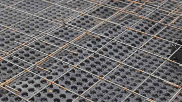 Reinforcement for reinforced concrete bonded over the membrane for waterproofing concrete. Pouring the foundation using modern waterproofing materials. Frame for the reinforced concrete stylobate