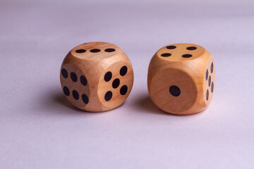 Two wooden dice isolated against a white background