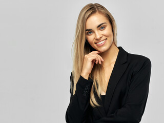 Fototapeta na wymiar Portrait of young beautiful female model wear black jacket and smiling