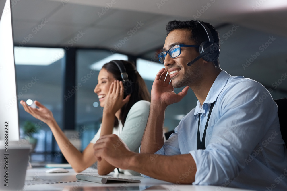 Aufkleber call us anytime to get it done. shot of a young man using a headset and computer in a modern office.