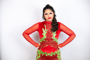 Young beautiful woman wearing carnival costume over isolated white background skeptic and nervous,...