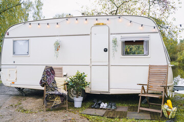 Family traveling in camper,house on wheels,trailer,motor home. Romantic road travel,freedom life.Campsite overnight, parking in van.Wanderlust vacation,weekend. Happy adventure.Relax area with chairs