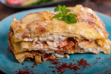 lasagna on a blue plate