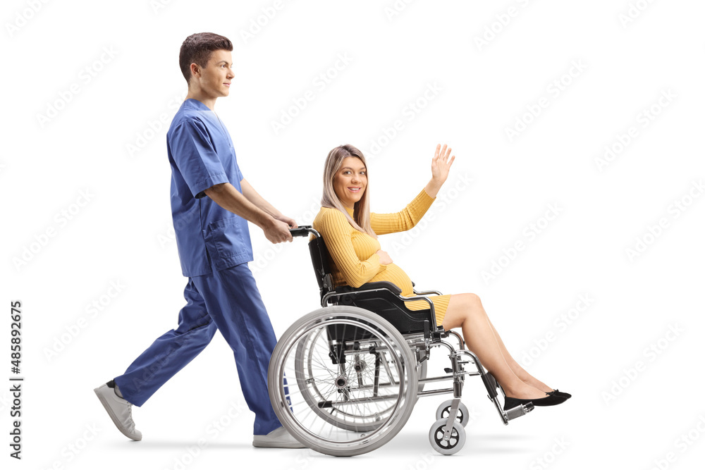 Canvas Prints full length profile shot of a male nurse pushing a pregnant woman waving and sitting in a wheelchair