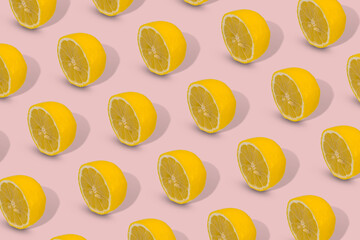 Trendy Summer pattern made with yellow lemon slice on bright blue background.
