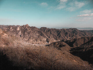 The Great Wall of China on the top of the Chinese mountains during winter - New Seven Wonders of the World