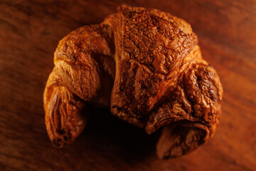 Fototapeta premium French Croissant closeup on wood