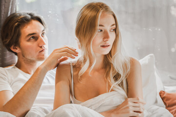 Young just married couple traveling in camper,house on wheels,trailer,motor home.Love romantic road travel,freedom life. Small bed,bedroom in van.Wanderlust vacation,weekend. Girl,guy,happy adventure