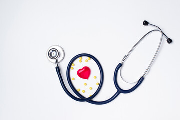 stethoscope with a red heart on a light background