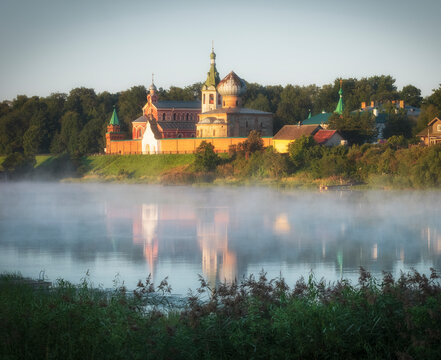 male Nikolsky monastery in Staraya Ladoga in the Leningrad Region on a foggy morning on the Volkhov River. Traveling on the rivers of Russia