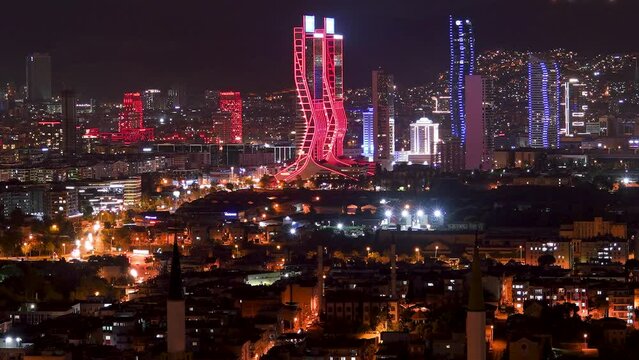 time lapse, izmir city skyline and traffic on highway at night with business buildings and sea	