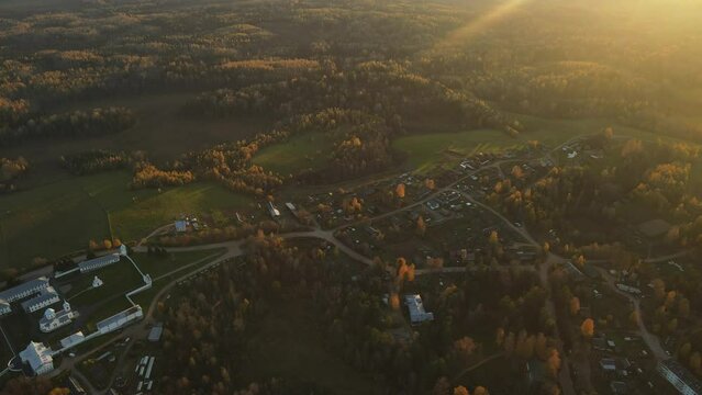 Pokrovsko-Tervenichesky monastery of the Leningrad region on the shore of the lake. Video of autumn landscape with a beautiful sunset and an Orthodox convent.