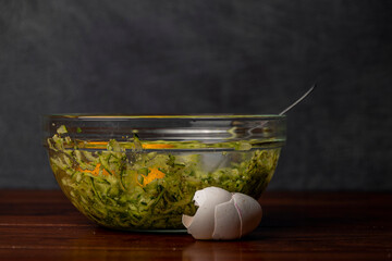 Preparing of courgette roll with ham and bacon and cheese with potatoes