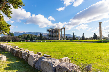 The Temple of Olympian Zeus also known as the Olympieion with ongoing maintenance works. Is a former colossal temple at the center of the Greek capital Athens. Sunny day with blue sky