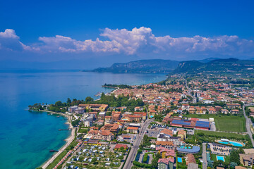 Fototapeta na wymiar In the city of Bardolino, Lake Garda, Italy. Aerial photography with drone. In the city of Bardolino, Lake Garda is the north of Italy. View by Drone. Aerial photography.