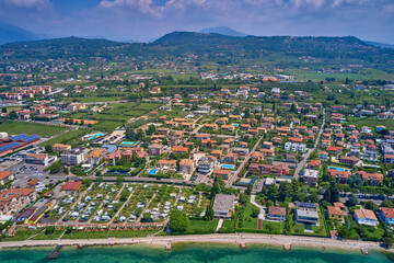 Beautiful coastline. In the city of Bardolino, Lake Garda, Italy. In the city of Bardolino, Lake Garda is the north of Italy. View by Drone. Aerial photography. Aerial photography with drone.