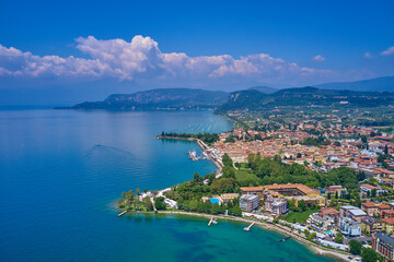 Docked yachts parking in Port. Aerial photography. Beautiful coastline. In the city of Bardolino, Lake Garda is the north of Italy. View by Drone.