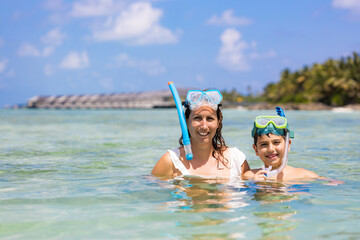 Mother and son snorkeling on the Maldive Islands