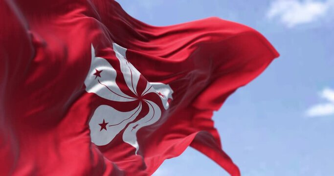 Detail of the civil flag of Hong Kong waving in the wind on a clear day.