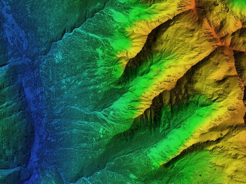 Digital elevation model. GIS product made after proccesing aerial pictures taken from a drone. It shows high rocky and steep mountain peaks. At their feet are visible valleys and mountain lakes