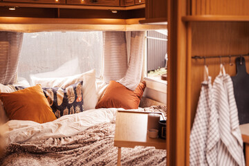 Family traveling in camper.Inside house on wheels,trailer,motor home.Bed in little bedroom.Romantic...