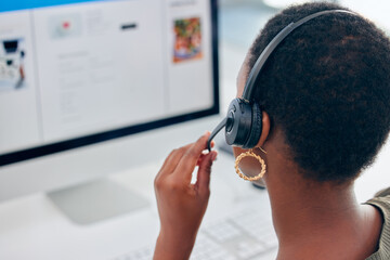 Wed love to hear what you think of our customer service. Shot of a businesswoman wearing a headset while working on her computer.