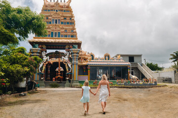 People go to an Indian temple on the island of Mauritius in the Indian Ocean