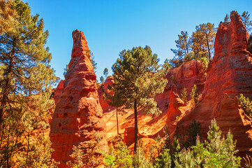 Rustrel canyon ocher landscape with magnificent cliff shapes. Provencal Colorado near Roussillon in Southern France.