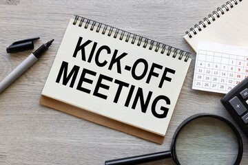 Kick-off meeting Message. open notepad with text on a rustic background. business concept - obrazy, fototapety, plakaty