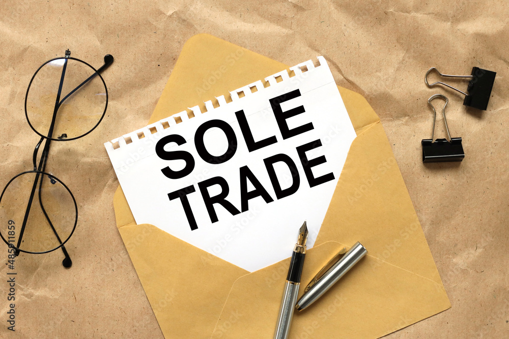 Aufkleber sole trader . text on white paper on envelope business and leadership styles concept.