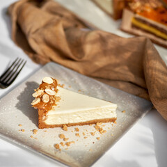 Sliced Cheesecake. Layer of biscuits, mousse based on creamcheese, with raspberry. Healthy dessert.