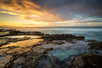 View of De Hoop Nature Reserve beautiful rocky coastline at sunrise, Western Cape, South Africa.