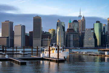 Fototapeta na wymiar Financial district skyline of downtown New York City shot from pier over East River