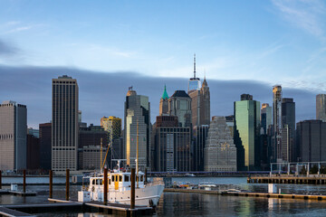 Fototapeta na wymiar Financial district skyline of downtown New York City shot from pier over East River