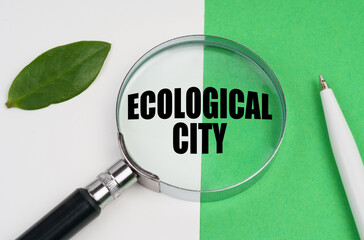 On a white-green background, a pen, a piece of paper and a magnifying glass with the inscription - Ecological City