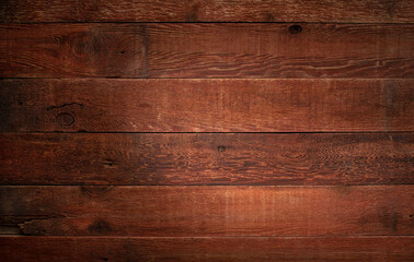 spotlight on red weathered barn wood background with knots and nail holes