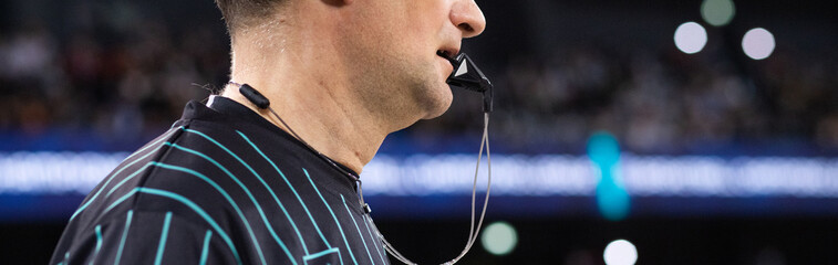 close up on whistle in referee mouth