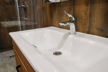 New white sink in hotel close-up.