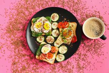 Plate with tasty toasts and cup of coffee on color background