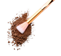 Makeup brush and loose eye shadow on white background
