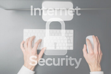 Safety computer security concept. Internet protection symbol on blured keyboard background. Concept image of security vulnerability and information leaks.