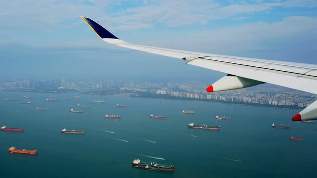 Large vessels. Many tankers. Ships on roadstead. View from plane. Singapore. Aerial view. Crossing of sea routes