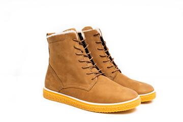 brown leather winter boots with lacing on a white background